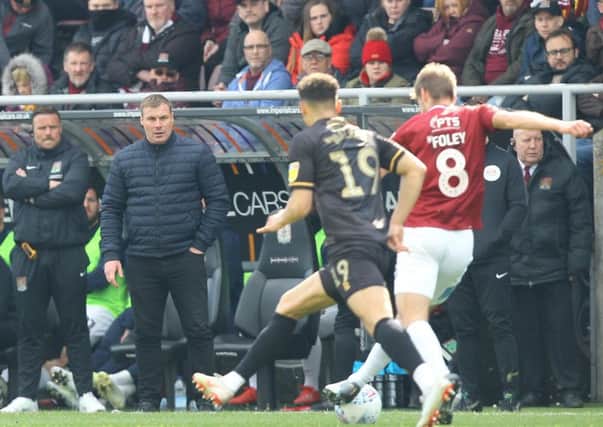Picture by Gareth Williams/AHPIX.com; Football; Sky Bet League Two; Northampton Town v Mansfield Town; 13/4/2019  KO 15.00; PTS Academy Stadium; copyright picture; Howard Roe/AHPIX.com; Mansfield boss David Flitcroft watches on as Tyler Walker presses Northampton's Sam Foley