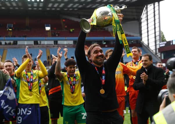 Daniel Farke celebrates with the Norwich players.