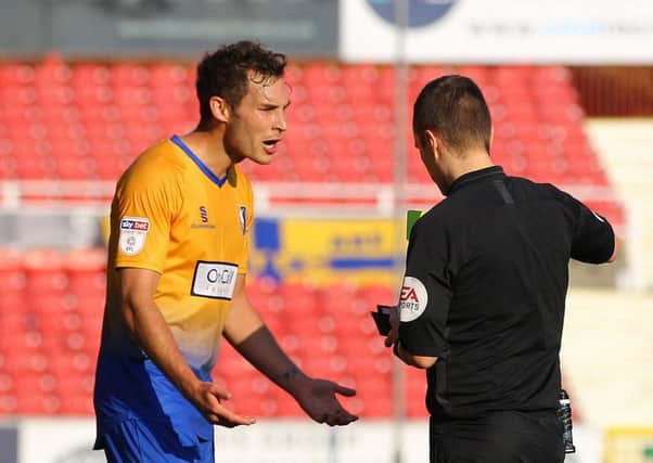 Picture by Gareth Williams/AHPIX.com; Football; Sky Bet League Two; Swindon Town v Mansfield Town; 20/10/18  KO 15:00; The Energy Check County Ground; copyright picture; Howard Roe/AHPIX.com; Mansfield's Will Atkinson pleads with referee Antony Coggins as he gives him a second yellow card at Swindon