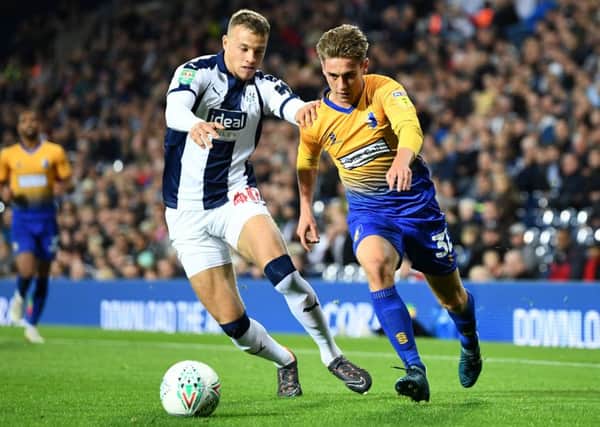 WEST BROMWICH, ENGLAND - AUGUST 28:  Kyle Howkins of West Bromwich Albion battles for possession with Danny Rose of Mansfield Town during the Carabao Cup Second Round match between West Bromwich Albion and Mansfield Town at The Hawthorns on August 28, 2018 in West Bromwich, England.  (Photo by Clive Mason/Getty Images)