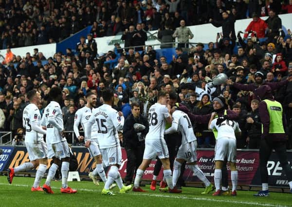 Swansea City celebrate after scoring their second goal against  Manchester City at The Liberty Stadium on 16th March.