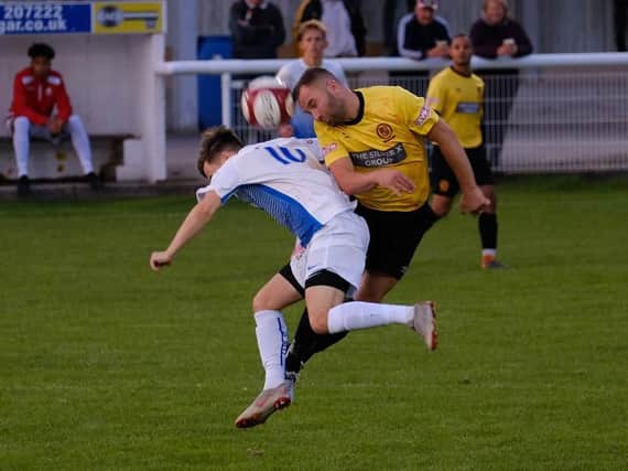 Action from Belper (in yellow) against Basford on Tuesday. Photo by Tim Harrison.