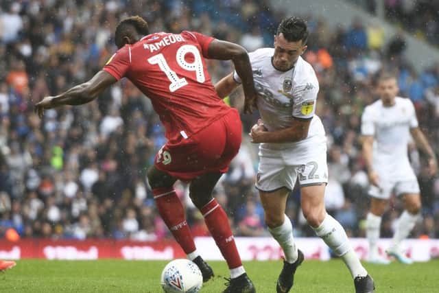 LEEDS, ENGLAND - AUGUST 10: Jack Harrison of Leeds United battles for the ball with Sammy Ameobi of Nottingham Forest during the Sky Bet Championship match between Leeds United and Nottingham Forest at Elland Road on August 10, 2019 in Leeds, England. (Photo by George Wood/Getty Images)