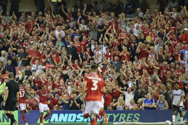 Reds fans celebrate Joao Carvalho's goal. Pic by Jez Tighe.