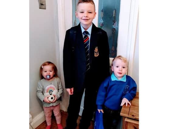 Amy Louisesaid: "My son Josh started his first day at secondary school and my second son Louie started pre school. Their sister Amelie didn't want to miss a photo opportunity too, particularly with her favourite football."