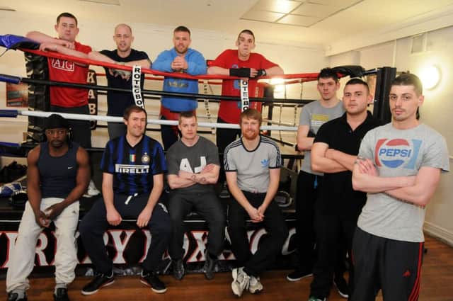 Probation Service boxing project.  Scheme members pictured with Kirkby Boxing Club owner, Richard Wheldon, back row, second right, and probation officers Andrew Toft, front second left, and Gareth Castick, front forth right.