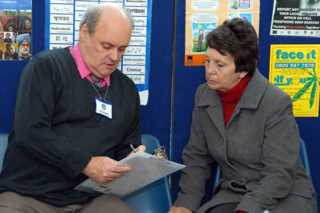 Ashfield Citizens Advice Bureau feature pictures.

Pictured is Sutton resident Patricia White with Volunteer Receptionist Richard Driver talking through the reception sheets.