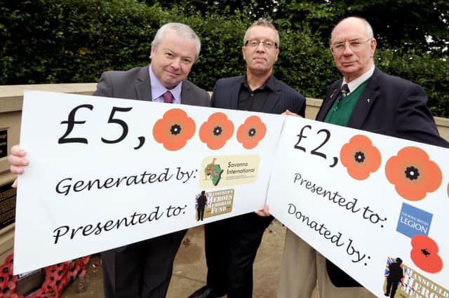 Cheque presentation for Heroes Memorial Fund at Carr Bank Memorial, l-r Martin Kinsella from Savanna Rags International, Graham Parker, David Addison Chair of Mansfield Bellamy Road Branch RBL.