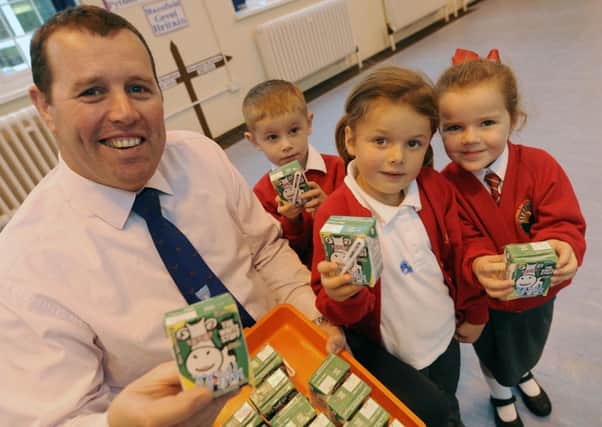 Mark Spencer MP visits Python Hill Primary School and becomes a milk monitor for the day.