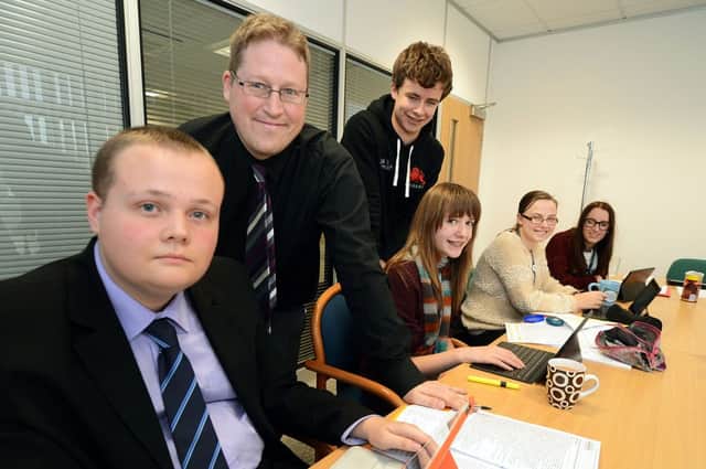 Chad's news editor Stephen Thirkill, second left, welcomes budding journalists from the Mansfield Learning Partnership to Chad's new offices.