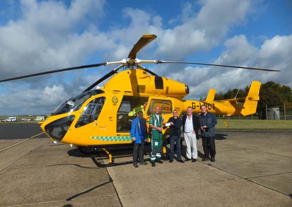 Mansfield and Ashfield hikers donate the cheque to crews at RAF Waddington