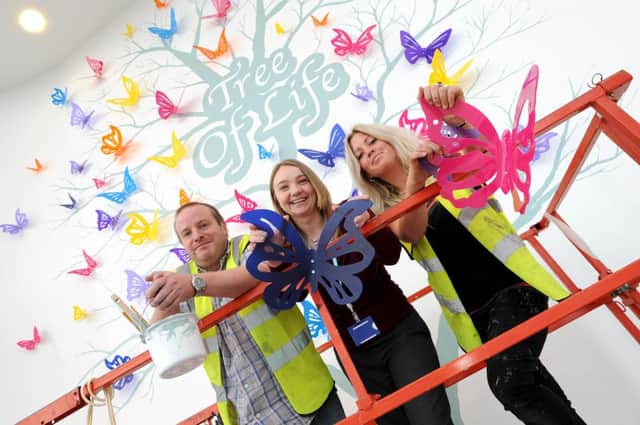 A work of art in progress at Kings Mill Hospital, dedicated to organ donors. l-r is Nathan Bainbridge, Sophie Wragg Marketing Manager and Anna Wheelhouse.