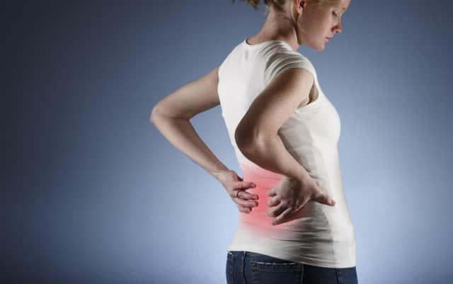 A Generic Photo of a woman suffering with back pain. See PA Feature WELLBEING Wellbeing Column. Picture credit should read: PA Photo/thinkstockphotos. WARNING: This picture must only be used to accompany PA Feature WELLBEING Wellbeing Column.