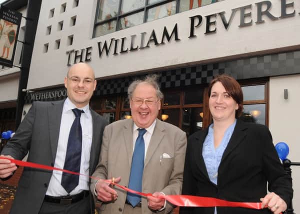 NHUD11-2445-3

Denis Robinson, centre, pictured with Scott Hutchinson, Manager of the Sir William Peverel and Duty manager Hannah Harwood at the opening on Tuesday.