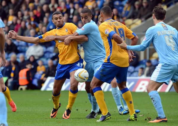 Stags v Plymouth Argyle.
Colin Daniel tussles with his marker.