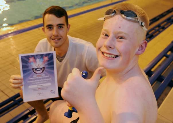 Owen Towle 15 has won a Kellogs outstanding achievement award for swimming, pictured here with swimming teacher, Josh Beeston.