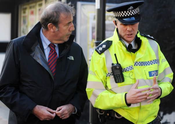 Police and Crime Commissioner Paddy Tipping sets out with the Neighbourhood Policing Team to see the work to tackle shop theft in the town centre and antisocial behaviour on Merchant Street and Lawton Drive/Golf Close.  Pictured here with Inspector Andy Goodall.