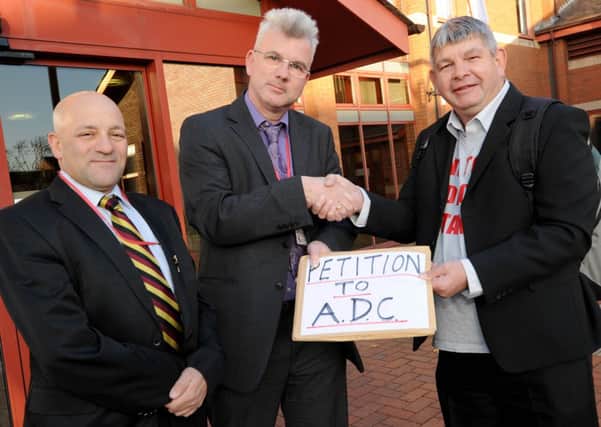 John Moore from Save our Services officially hands over petition to stop the bedroom tax to ADC. l-r is Cllr Linford Gibbons Kirkby East, David Greenwood Dep Chief Exec and John Moore.