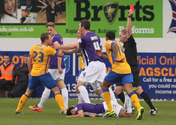 Mansfield's Jamie McGuire is shown the red card by referee Charles Breakspear  -Pic by:Richard Parkes