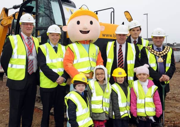The start of new housing developments at the old Sutton Baths site. Children from Bright Stars Childcare visit Bob The Builder on site. l-r back is Cllr Chris Baron, Cllr Steve Caroll, Cllr Warren Nuttall, David Kirkham and Cllr Linford Gibbons Kirkby East.