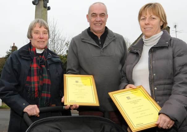 Linby has won best kept village award. l-r is Claire Hardstaff, Bob Brothwell and Denise Ireland. The twins are 9mnth old William and Alice who are the 10th generation of a Linby family.