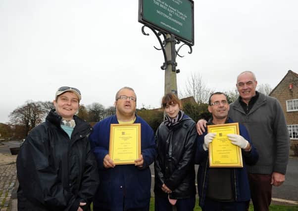 Linby has won best kept village award. Pictured are service users of Brook Farm with Bob Brothwell at the far right.