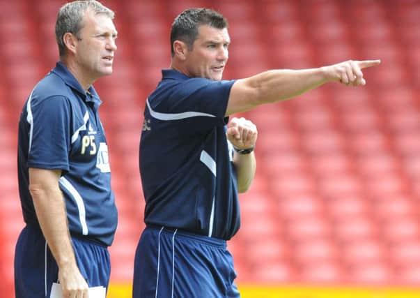 Richie Barker, seen here with assistant Peter Shirtliff during his time managing Bury, has adapted well to life in the dug-out.