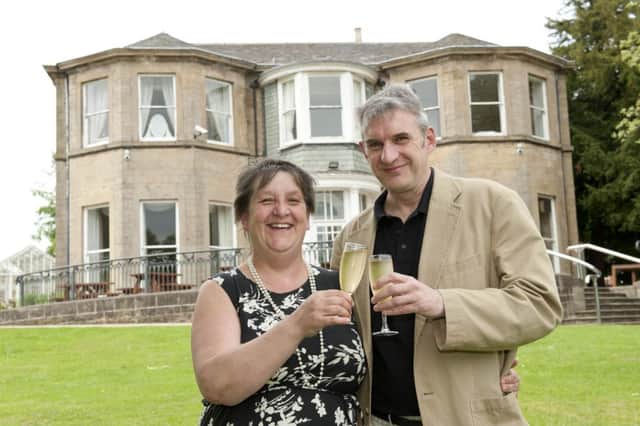 Paul Andrews and partner Diane Doran owners of the Mansfield Manor Hotel celebrate their first year in business