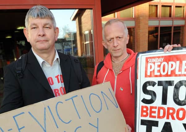 John Moore from Save our Services officially hands over petition to stop the bedroom tax to ADC. Pictured is John Moore and Ivan Scarborough also from Save our Services.