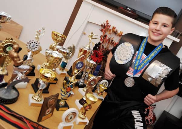 Cade Hardy, 14, of Sutton, is an English kickboxing champion.
