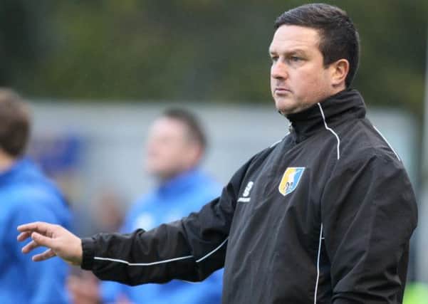 Mansfield Town's manager Paul Cox is in favour of terracing.