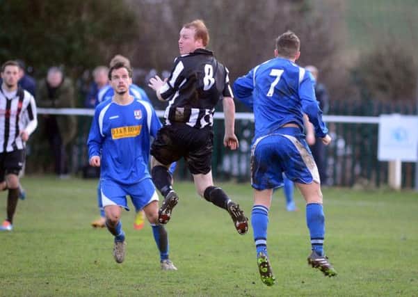 Clipstone v Teversal
Clipstone's Jason Edwards out jumps his marker.