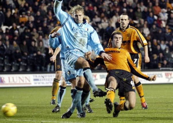 Battling hard: Laim Lawrence fights or possession with Hull's Ben Burgess.