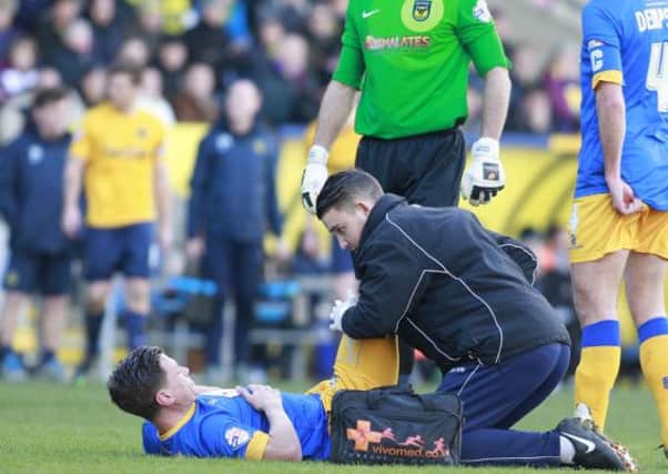 James Jennings receives treatment from Physio Simon Murphy -Pic by: Richard Parkes