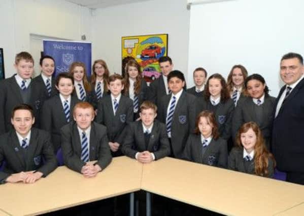 Selston High School Head teacher, Kevin Gaiderman, right, pictured with some of his pupils.