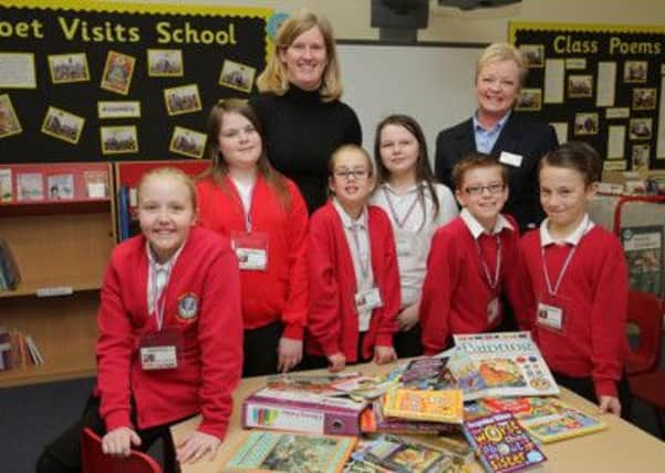 Samuel Barlow School pupils take delivery of books donated by Taylor Wimpey.