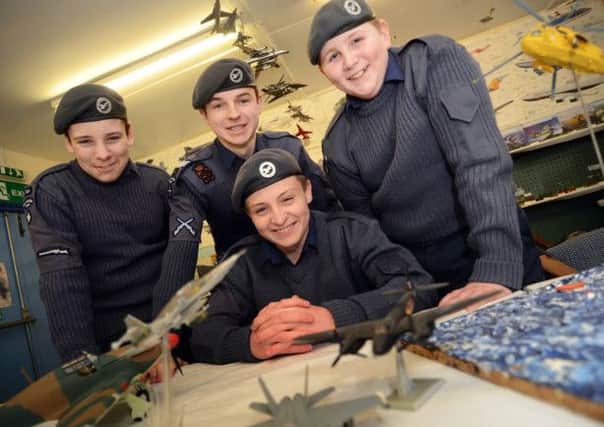 Air cadet Simon Williams, standing centre, with some of the new recruits, who welcome other young people to join them at their Botany Avenue headquarters.