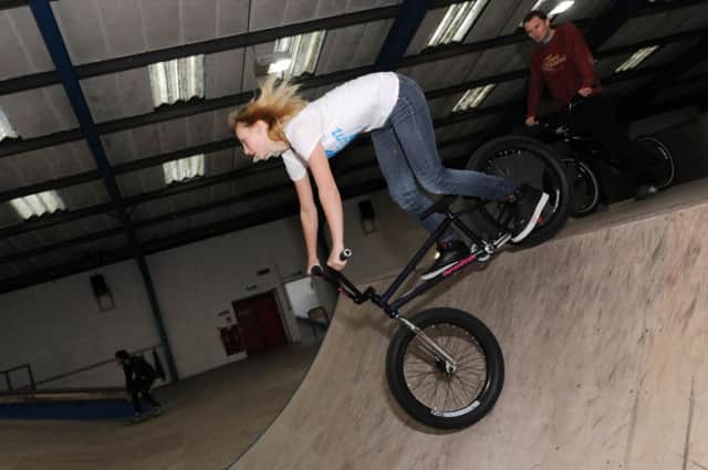 Asylum Skatepark, Huthwaite.

Kayley Ashworth showing Chad reporter Ben McVay how to ride a BMX.