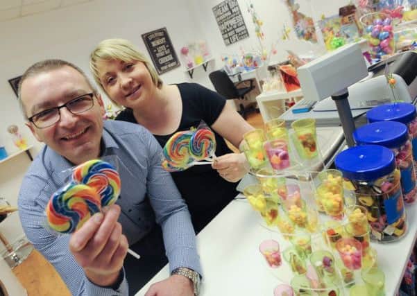 Jason Colclough and Rachel Taylor-Colclough hold a grand opening of their new sweet shop Sweet Explosion in the Idlewells Shopping Centre.