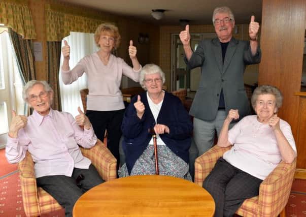 Residents celebrate after housing complex is saved, pictured are back Joy and Barry Middleton, seated from left Olga Wild, Pam Clarke and Kathleen Radford