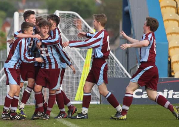 Liam Beardsley is mobbed by his team mates after scoring for Underwood Villa -Pic by: Richard Parkes