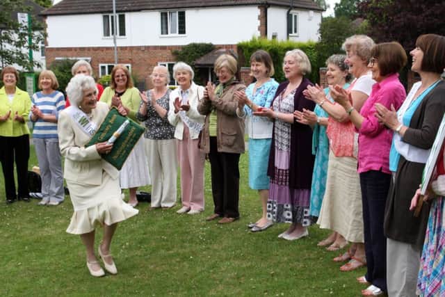 Marjorie Eyre show off the baton to other members of Ravenshead WI.