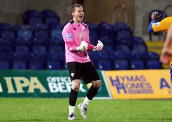 Mansfield Town goalkeeper Alan Marriott celebrates his goal against Wrexham. Picture by Dan Westwell.