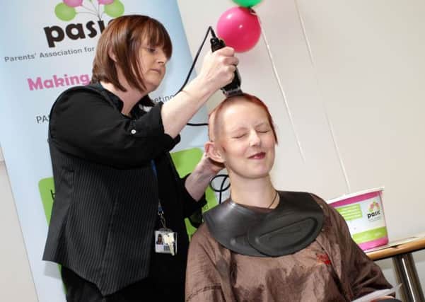 Emma Carroll had her head shaved at West Notts College in Mansfield to raise money for PASIC nmac-18-06-14 head shav