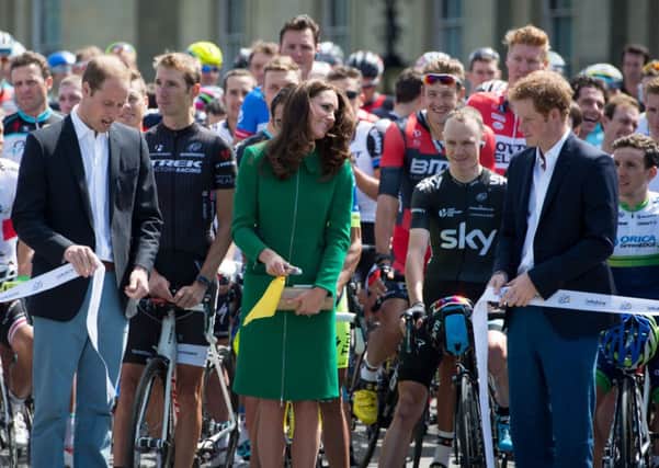 The Duke and Duchess of Cambridge, with Prince Harry, cut the ribbon to star The Tour de France Grand Depart at Harewood House, Leeds. Photo: Tim Ireland/PA Wire.