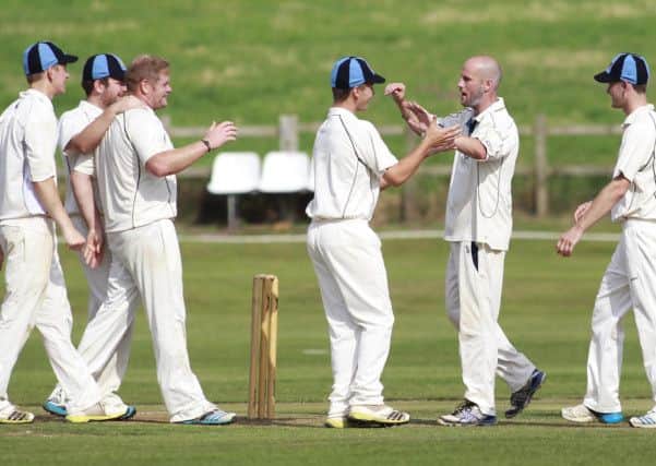 Ian Parkin receives thanks for his team mates a fantastic catch in the slips sends Kimberley's Aldred back to the pavilion -Pic by: Richard Parkes