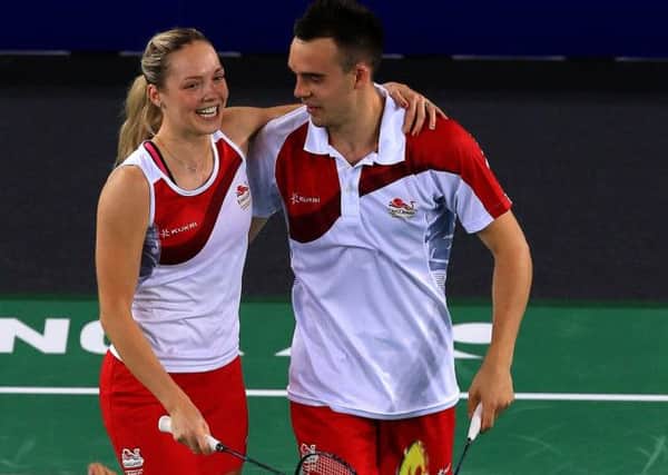 Gabrielle Adcock and Chris Adcock celebrate winning their game against Malaysia in the mixed doubles. Picture by Peter Byrne/PA Wire.
