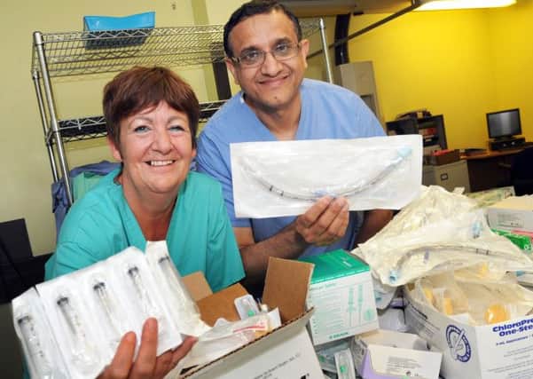 Consultant general surgeon Irfan Akhtar and department theatre sister Denise Guzdz with a selection of donated medical supplies collected for Gaza.