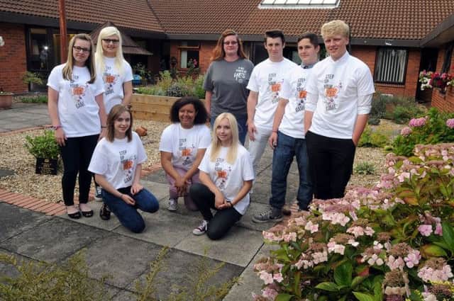 The NCS Ollerton team responsible for the garden overall done at the Bishop's Court Residential Home in Boughton, they are from left, back row, Coral Shaw, Abbie Anderson, team leader Liz Spowage, James Chauntry, Ashley Parker, Ben Britton, with from left, front row, Tea Milligan, Zoe-Zara Garner and Emma-Jayne Burton.