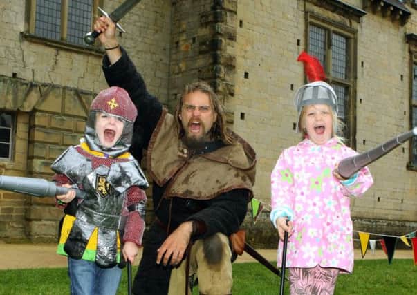 NDET 25-8-14 Joust MC 2
Bolsover Castle Joust event attracts visitor twins Sam and Sky Armstrong aged 4 from Bawtry. also pictured is Carlos Moir.